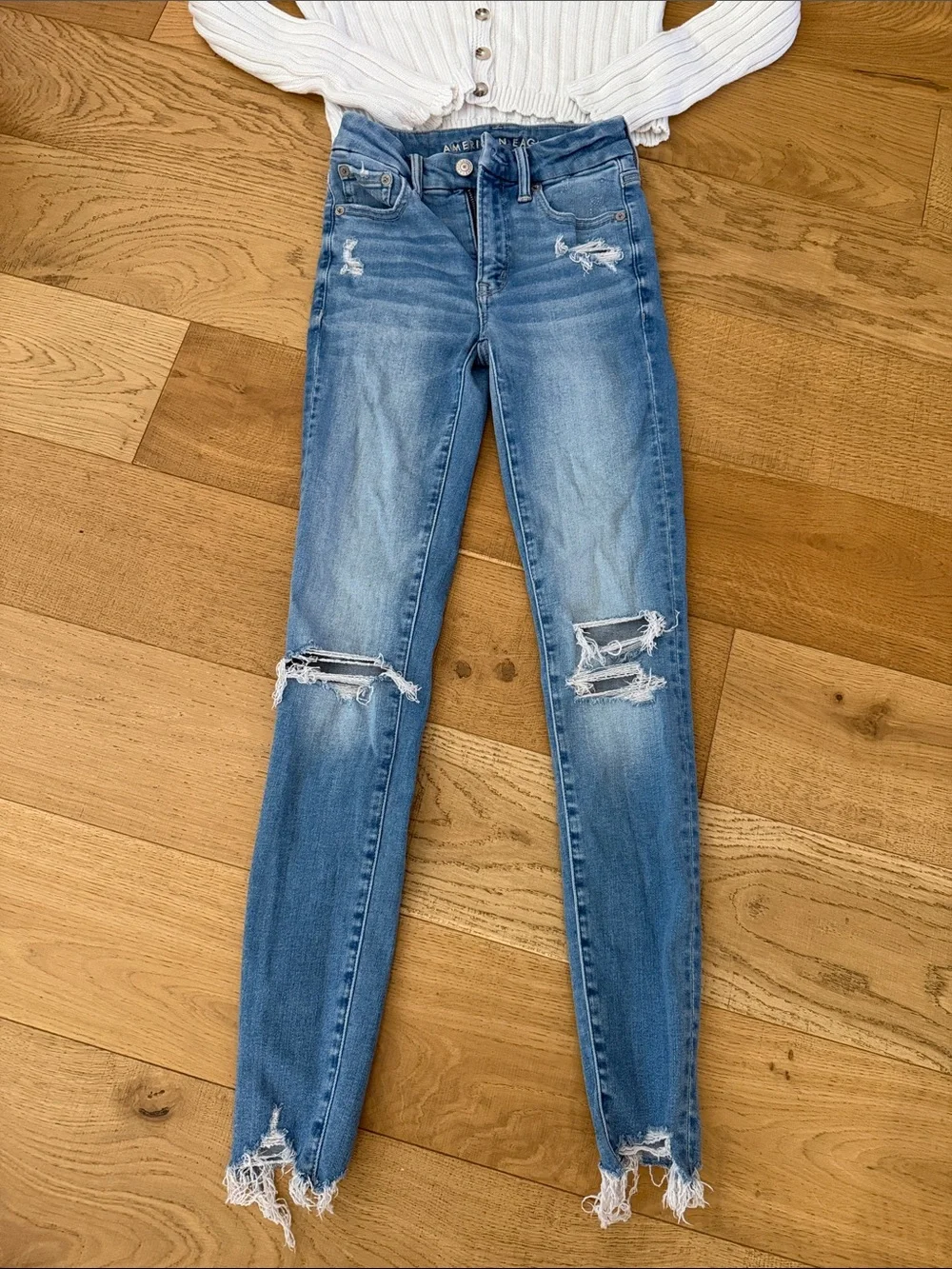 American Eagle Outfitters Skinny Jeans Paired with Button Down Sweater